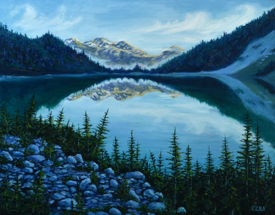 Joffre lake. Mountains in the distance with calm waters in the foreground. Trees and rocks surrounding the lake. Faint clouds off in the distance. British Columbia paintings of west coast landscapes. Ezra Larsen